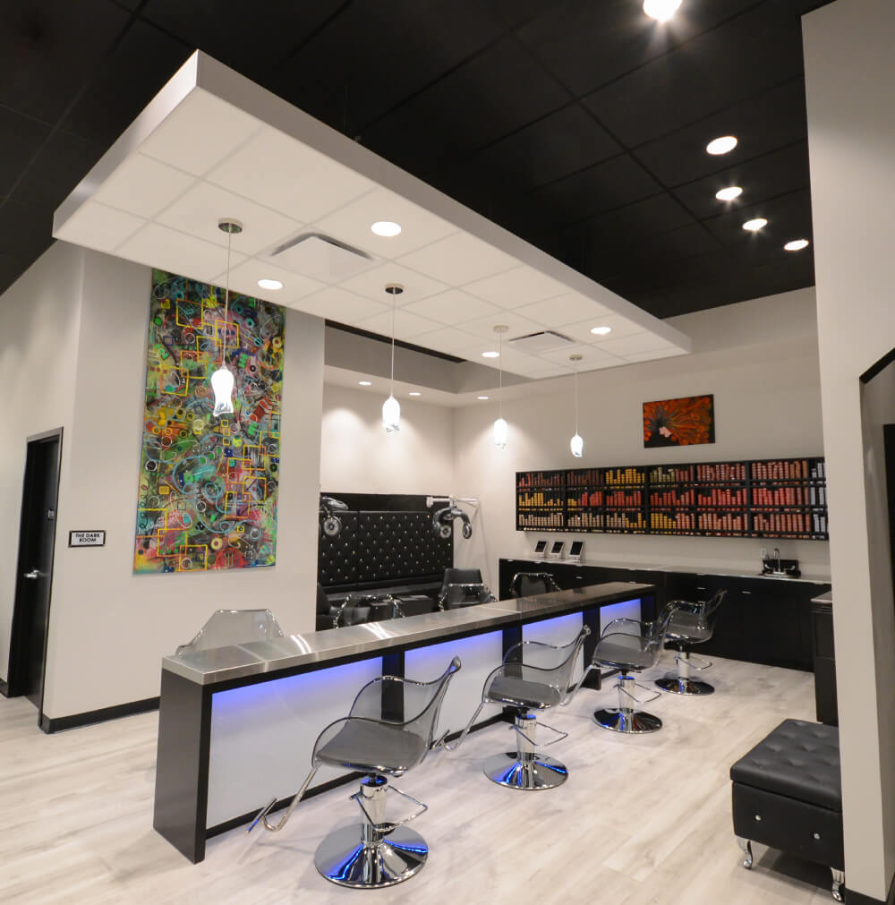 - Studio Wish Salon Spa in Twinsburg, OH Modern hair salon interior with black chairs, workstations, colorful wall art, shelves of hair products and modern hair color options, plus bright overhead lighting—perfect for a bridal beauty salon experience. - Studio Wish Salon Spa in Twinsburg, OH